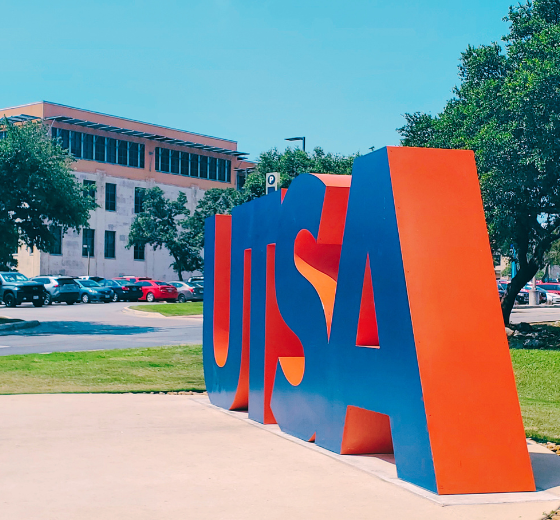 UTSA Monument with Business Building in background.