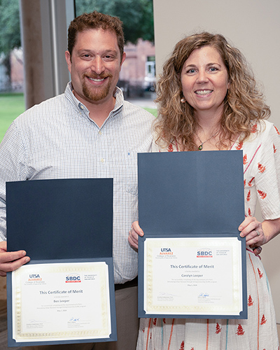 Ben and Carolyn Leeper with SURE certificates