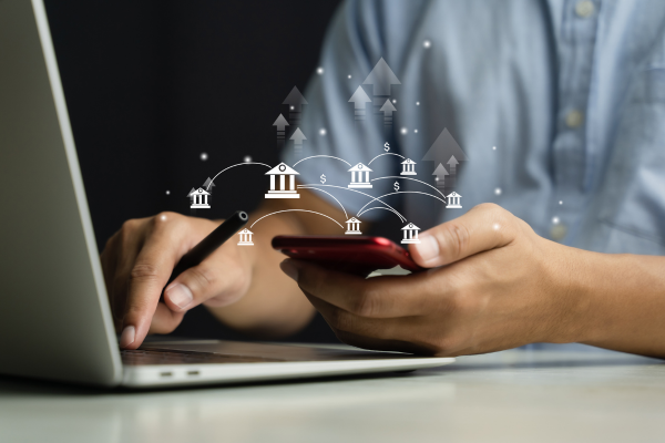 Human using cellphone while online banking