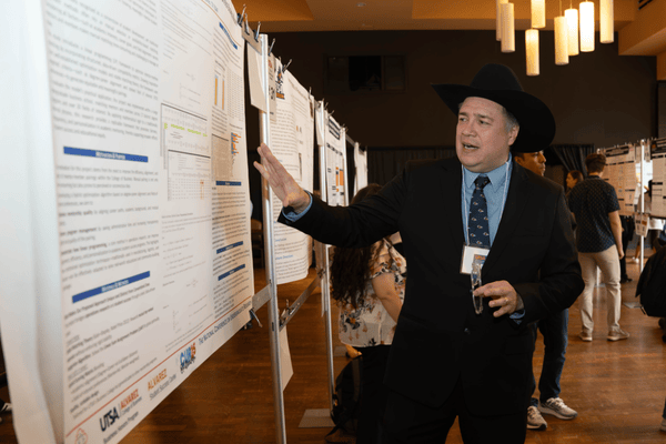 Efrain Garza presenting his research at the UTSA undergraduate student research showcase, 2025.