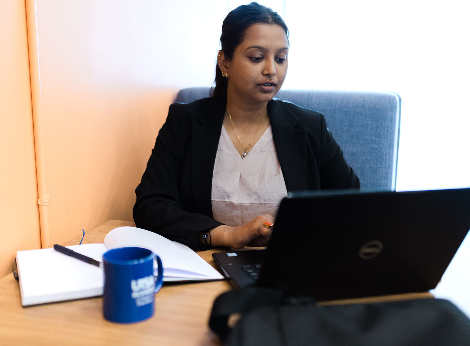 Female graduate student studying