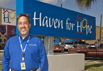 Mark Carmona in front of Haven for Hope sign