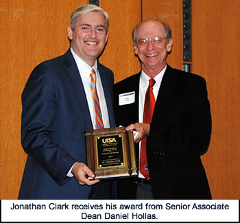 Jonathan Clark receives award from Dan Hollas