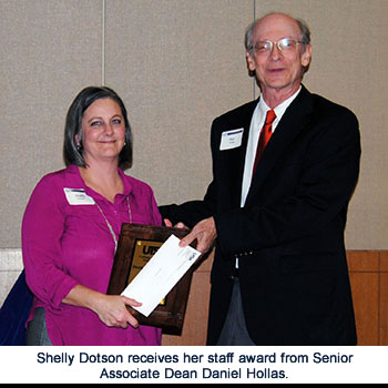 Shelly Dotson receives award from Dan Hollas