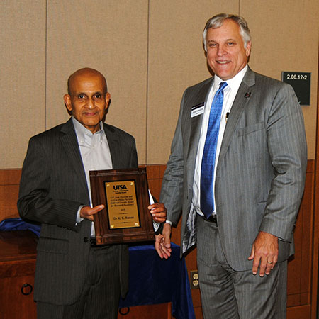 K. K. Raman receiving his award from Dean Gerry Sanders.