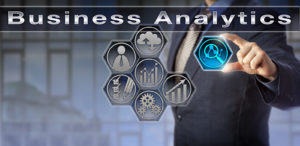 Business Analytics with man holding icon with of a magnifying glass and line graph