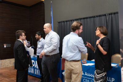 Students speaking with employers at annual recruiting expo
